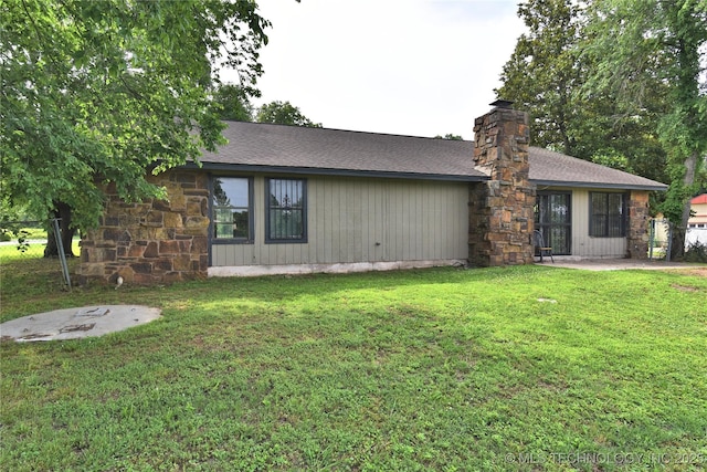 134 Spunky Creek Dr, Catoosa, OK 74015 - view of front of home featuring a front lawn, a shingled roof, and a chimney