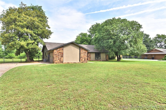 134 Spunky Creek Dr, Catoosa, OK 74015 - view of property exterior with concrete driveway, stone siding, an attached garage, and roof with shingles