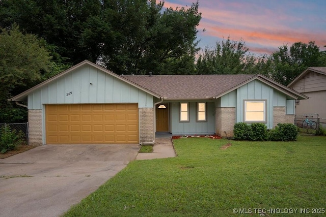 349 S 185th E Ave, Tulsa, OK 74108 - ranch-style home with board and batten siding, an attached garage, a shingled roof, brick siding, and concrete driveway