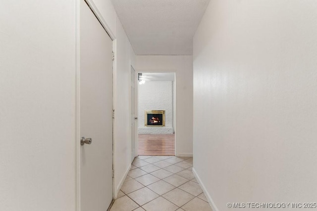 349 S 185th E Ave, Tulsa, OK 74108 - hall with light tile patterned floors and baseboards