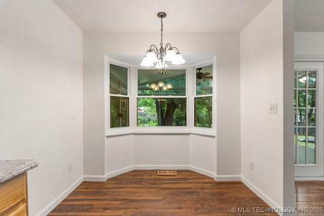 349 S 185th E Ave, Tulsa, OK 74108 - unfurnished dining area featuring a chandelier, dark wood-style flooring, and baseboards