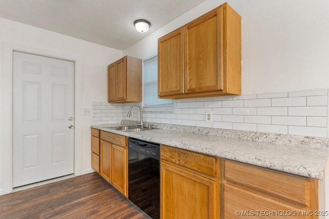 349 S 185th E Ave, Tulsa, OK 74108 - kitchen featuring dishwasher, a sink, dark wood-style flooring, tasteful backsplash, and brown cabinetry