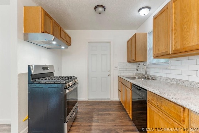 349 S 185th E Ave, Tulsa, OK 74108 - kitchen with stainless steel range with gas stovetop, dishwasher, a sink, range hood, and dark wood-style flooring