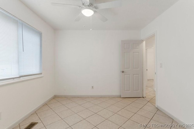349 S 185th E Ave, Tulsa, OK 74108 - unfurnished room featuring light tile patterned flooring, ceiling fan, and baseboards