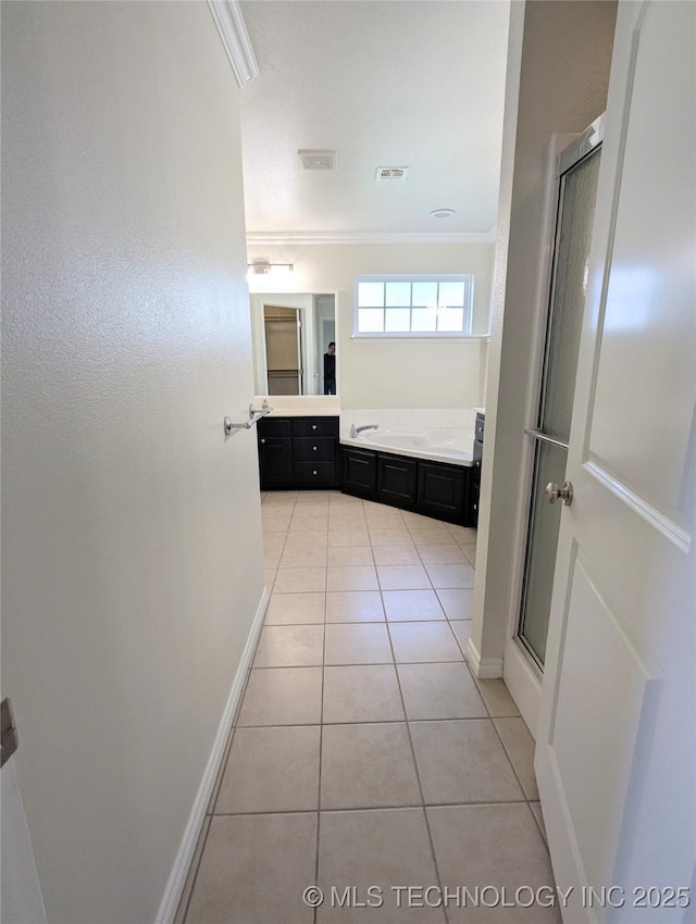 7870 N 163rd E Ct, Owasso, OK 74055 - full bath with ornamental molding, vanity, tile patterned floors, baseboards, and a shower with shower door