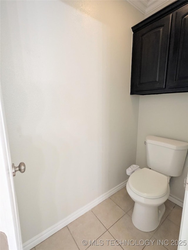 7870 N 163rd E Ct, Owasso, OK 74055 - bathroom with toilet, tile patterned floors, baseboards, and ornamental molding