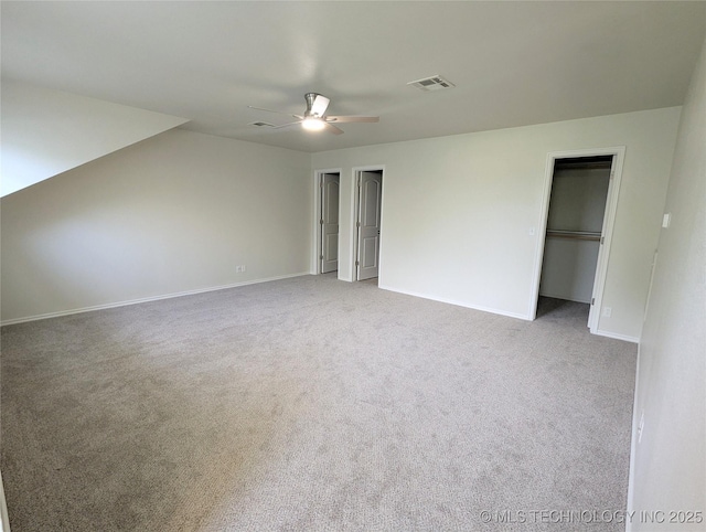 7870 N 163rd E Ct, Owasso, OK 74055 - unfurnished bedroom with carpet floors, baseboards, ceiling fan, and multiple closets