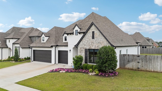 602 E 130th St S, Jenks, OK 74037 - french country style house with concrete driveway, an attached garage, stone siding, a shingled roof, and stucco siding