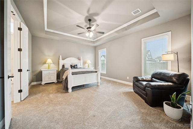 602 E 130th St S, Jenks, OK 74037 - bedroom featuring a raised ceiling, light carpet, and a ceiling fan