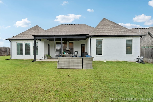 602 E 130th St S, Jenks, OK 74037 - back of property featuring a shingled roof, a fenced backyard, brick siding, and a ceiling fan