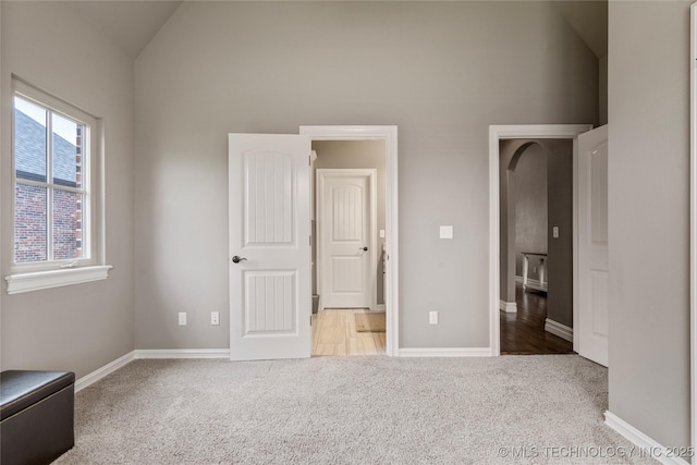 12934 S 2nd St, Jenks, OK 74037 - unfurnished bedroom featuring carpet floors, baseboards, and high vaulted ceiling