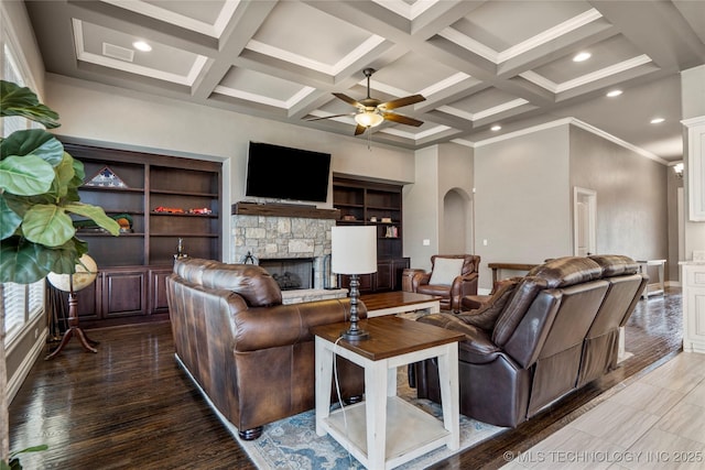 12934 S 2nd St, Jenks, OK 74037 - living room featuring a stone fireplace, a ceiling fan, coffered ceiling, beam ceiling, and crown molding