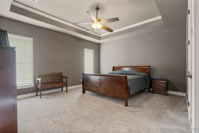 12934 S 2nd St, Jenks, OK 74037 - carpeted bedroom featuring a raised ceiling, baseboards, multiple windows, crown molding, and a ceiling fan