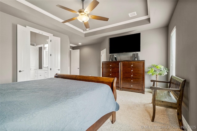 12934 S 2nd St, Jenks, OK 74037 - carpeted bedroom with a tray ceiling, baseboards, ceiling fan, ornamental molding, and connected bathroom