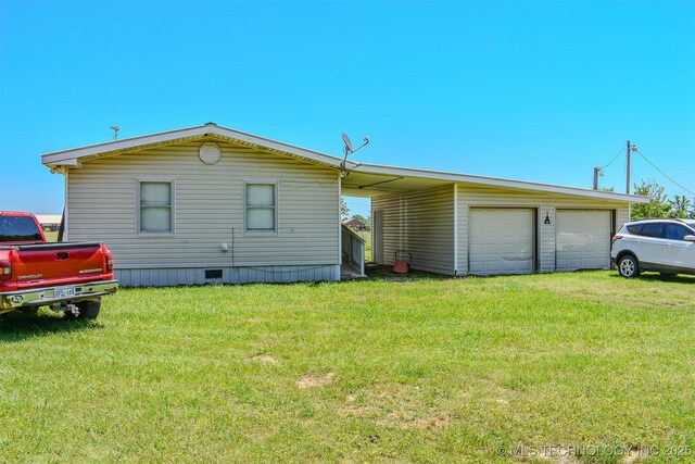 919 N 4210th Rd, Hugo, OK 74743 - rear view of property with a lawn, a garage, and crawl space