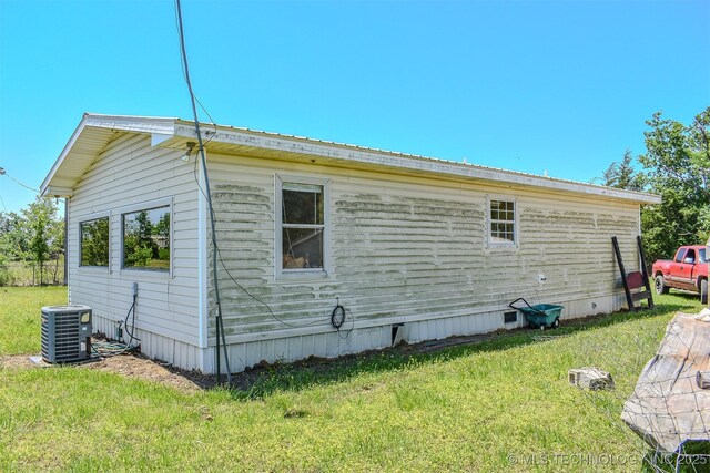 919 N 4210th Rd, Hugo, OK 74743 - view of property exterior with central AC and a yard