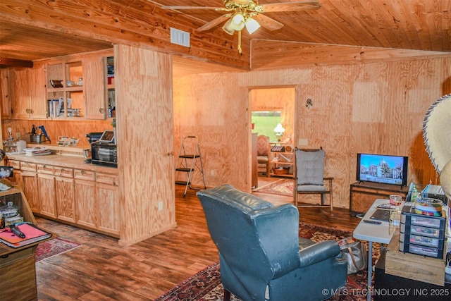 919 N 4210th Rd, Hugo, OK 74743 - living area featuring wood finished floors, wood ceiling, a ceiling fan, and wooden walls
