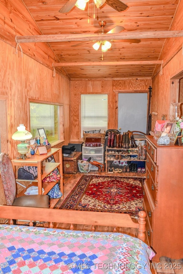 919 N 4210th Rd, Hugo, OK 74743 - sitting room featuring wood ceiling, wooden walls, and ceiling fan