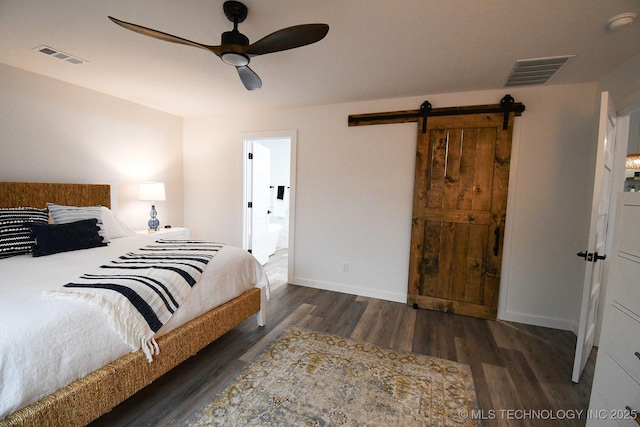 20471 W Chicken Creek Rd, Cookson, OK 74427 - bedroom with a barn door, wood finished floors, baseboards, ceiling fan, and connected bathroom