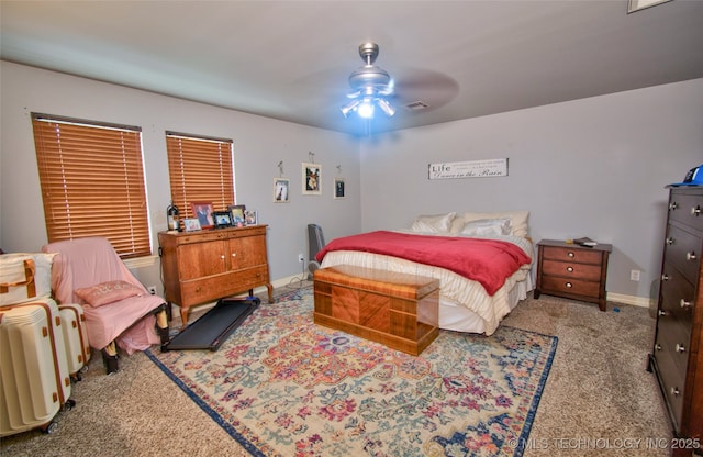 2430 S 31st St E, Muskogee, OK 74403 - carpeted bedroom featuring baseboards and ceiling fan