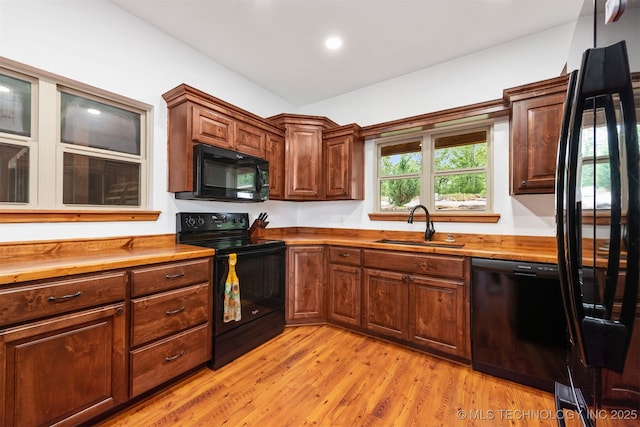 5687 Lake Jackson Rd, Mounds, OK 74047 - kitchen featuring black appliances, a sink, wood counters, light wood finished floors, and recessed lighting