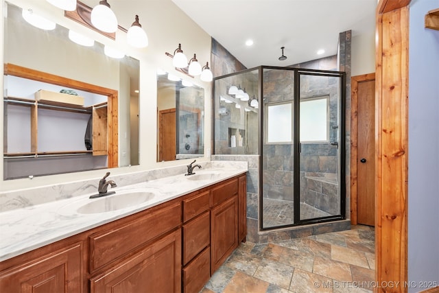 5687 Lake Jackson Rd, Mounds, OK 74047 - full bath with a stall shower, double vanity, stone finish floors, and recessed lighting