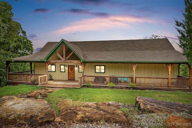 5687 Lake Jackson Rd, Mounds, OK 74047 - view of front of property with covered porch, a front yard, and a shingled roof