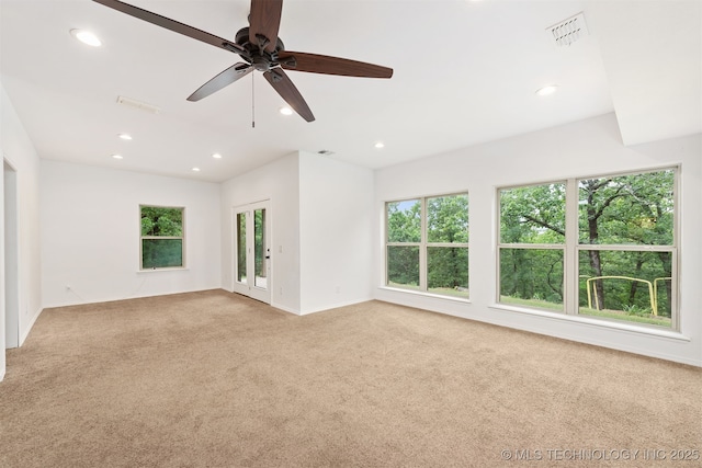 5687 Lake Jackson Rd, Mounds, OK 74047 - spare room with light carpet, recessed lighting, ceiling fan, and baseboards