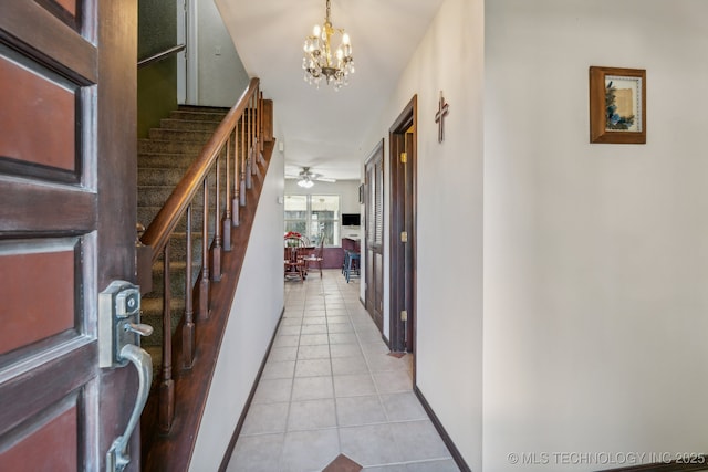 6506 E 99th St, Tulsa, OK 74133 - entryway with light tile patterned floors, stairs, a chandelier, ceiling fan, and baseboards