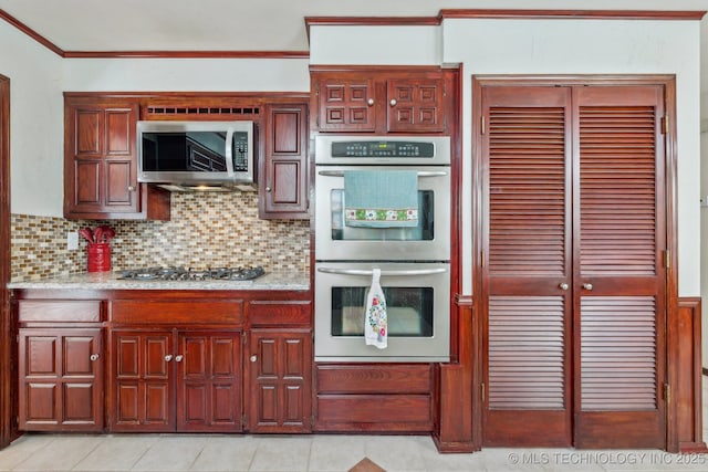6506 E 99th St, Tulsa, OK 74133 - kitchen with stainless steel appliances, tasteful backsplash, ornamental molding, and light tile patterned floors