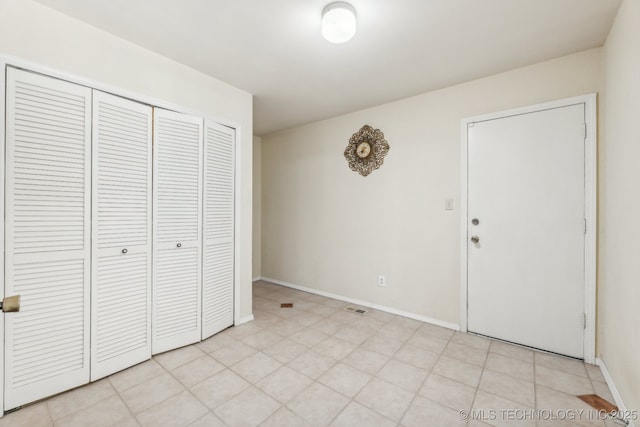 6506 E 99th St, Tulsa, OK 74133 - unfurnished bedroom with a closet and baseboards