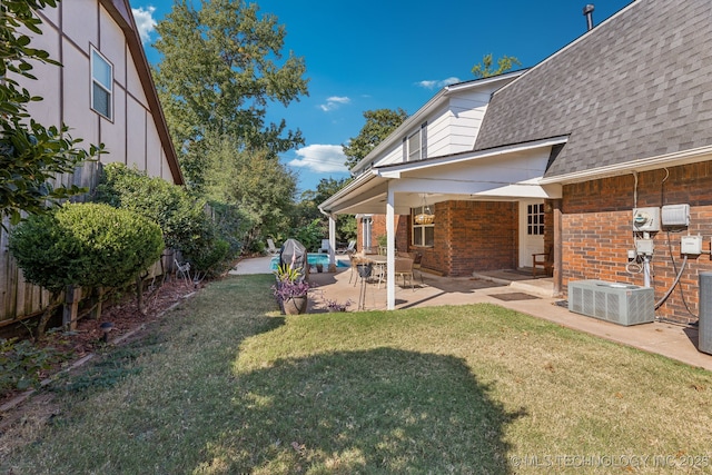 6506 E 99th St, Tulsa, OK 74133 - view of yard with central air condition unit and a patio
