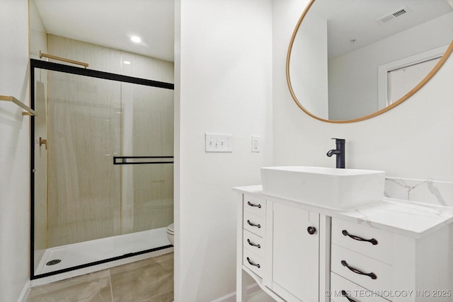 5810 E Skelly Dr Unit 303, Tulsa, OK 74135 - bathroom featuring vanity, a stall shower, toilet, baseboards, and recessed lighting