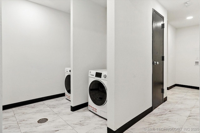 5810 E Skelly Dr Unit 303, Tulsa, OK 74135 - laundry room featuring light marble finish floors, baseboards, washer and dryer, and recessed lighting