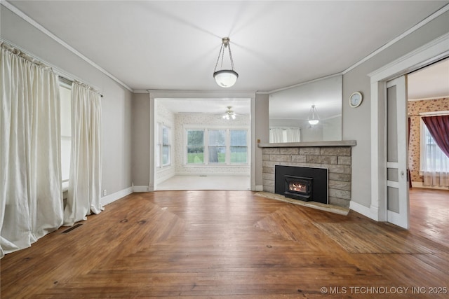 410 S Seminole Ave, Okmulgee, OK 74447 - unfurnished living room with ornamental molding, a fireplace, baseboards, and ceiling fan
