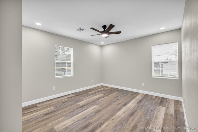 6948 E Marshall Pl, Tulsa, OK 74115 - empty room featuring wood finished floors, ceiling fan, recessed lighting, and baseboards