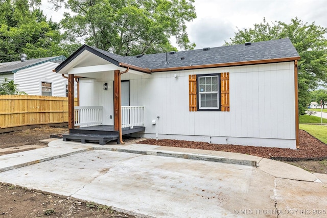 6948 E Marshall Pl, Tulsa, OK 74115 - rear view of property featuring a patio area and a shingled roof