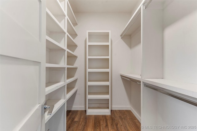 14382 Adams Rd, Mounds, OK 74047 - walk in closet featuring dark wood finished floors