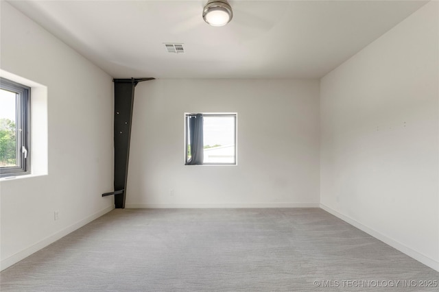 14382 Adams Rd, Mounds, OK 74047 - empty room with plenty of natural light and light carpet