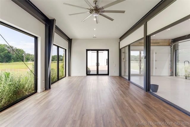14382 Adams Rd, Mounds, OK 74047 - unfurnished room with wood finished floors, ceiling fan, french doors, and recessed lighting