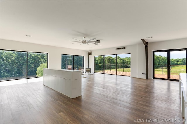 14382 Adams Rd, Mounds, OK 74047 - unfurnished living room with wood finished floors and a ceiling fan