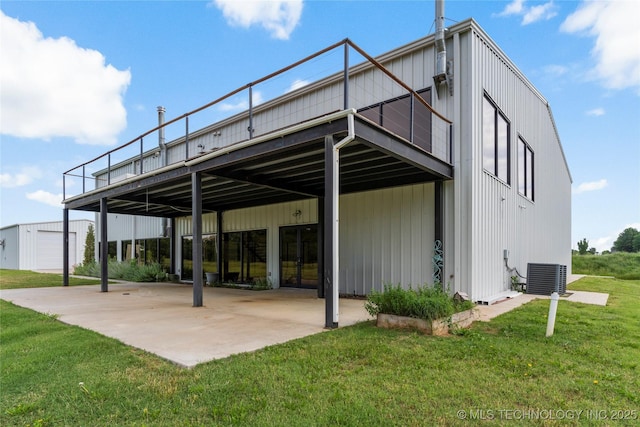 14382 Adams Rd, Mounds, OK 74047 - back of property featuring a yard and a patio area