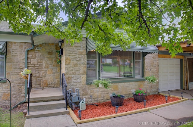 806 S New Haven Ave, Tulsa, OK 74112 - doorway to property featuring stone siding and a garage