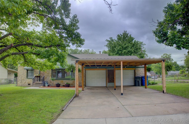 806 S New Haven Ave, Tulsa, OK 74112 - view of front of home with stone siding, concrete driveway, and a garage
