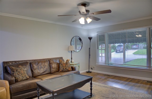 806 S New Haven Ave, Tulsa, OK 74112 - living room with wood finished floors, ceiling fan, baseboards, and ornamental molding