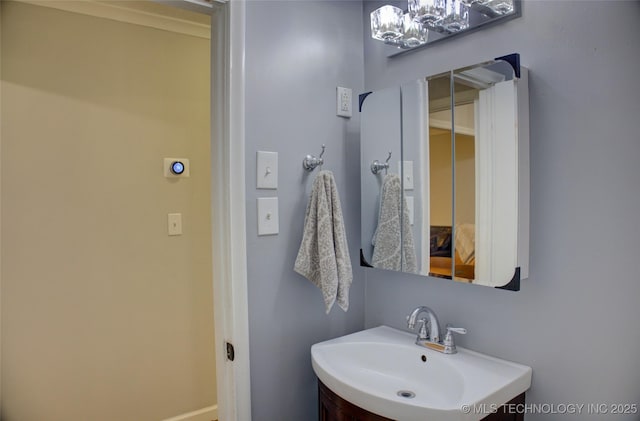 806 S New Haven Ave, Tulsa, OK 74112 - bathroom with vanity, a chandelier, and baseboards