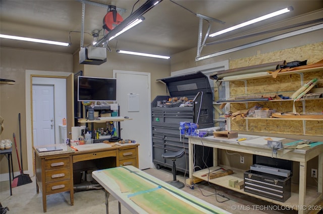 806 S New Haven Ave, Tulsa, OK 74112 - garage with a workshop area and a garage door opener