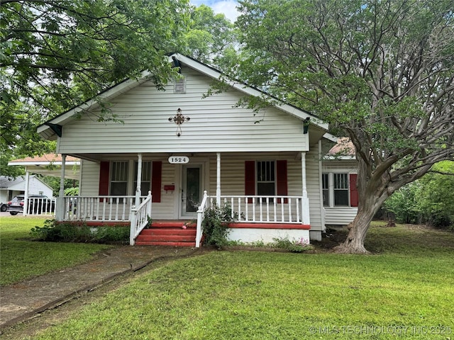 1524 W Maple St W, Durant, OK 74701 - bungalow-style house with covered porch and a front yard