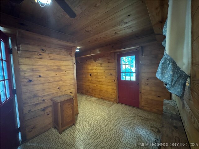 1524 W Maple St W, Durant, OK 74701 - entryway featuring wooden ceiling, wooden walls, tile patterned floors, and a ceiling fan