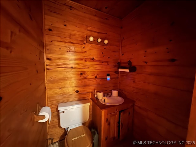 1524 W Maple St W, Durant, OK 74701 - half bath with toilet, vanity, and wood walls